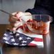 Illustration for article titled A Beautiful Tribute: This Woman Is Using An American Flag-Themed Disposable Napkin In Honor Of Her Country